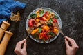 cropped shot of person eating delicious salad with mussels, vegetables Royalty Free Stock Photo